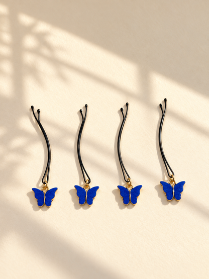 Blue butterfly charm hair pins displayed individually