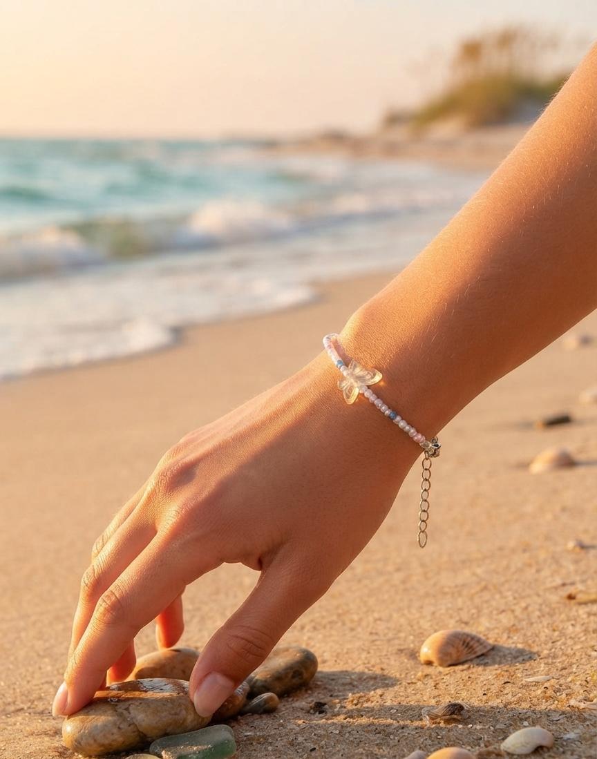 White bead bracelet with clear butterfly charm
