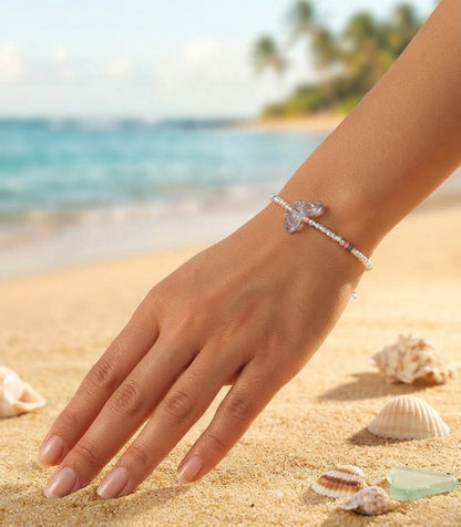 White bead bracelet with grey butterfly charm