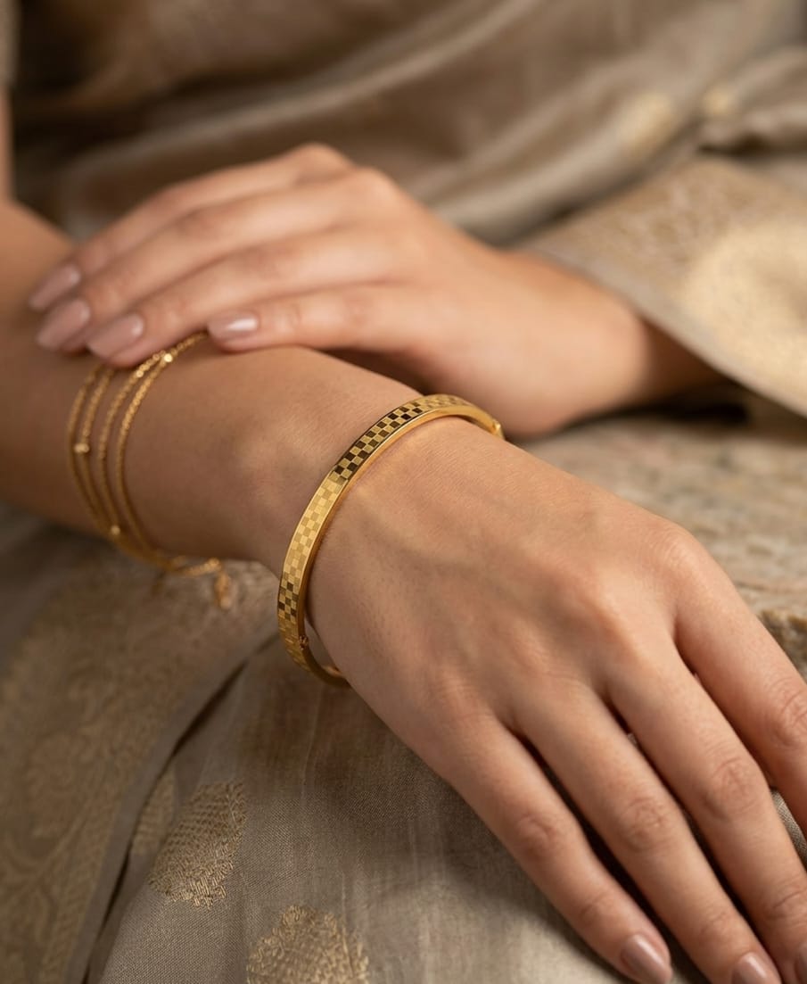 Gold-colour cuff bracelet with checkered pattern