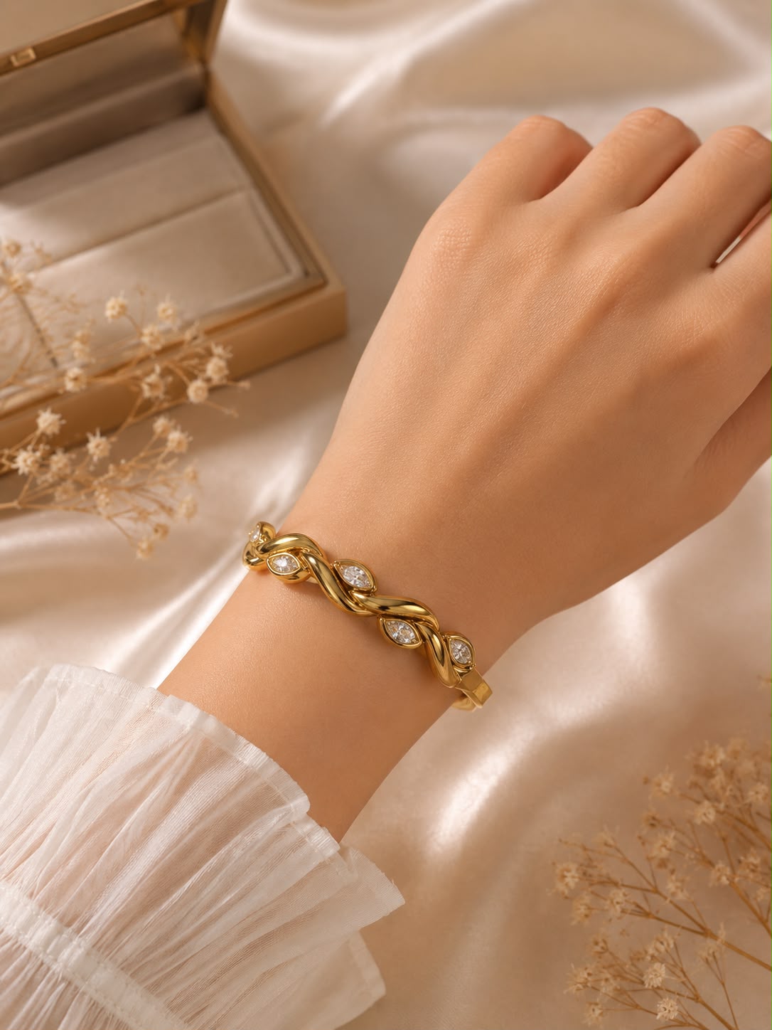 Gold-colour small kada with leaf-shaped clear stone details