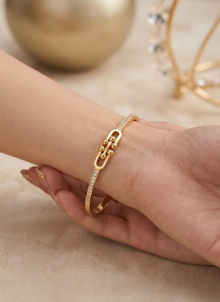 Gold-colour link bracelet with clear stone details