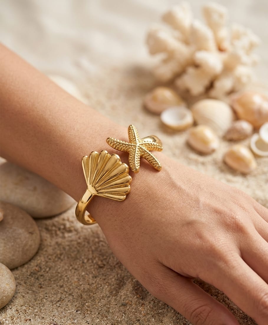 Gold-colour cuff bracelet with seashell and starfish