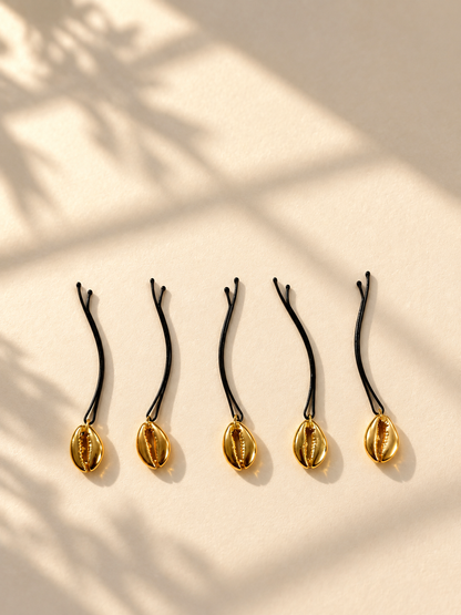 Gold shell charm hair pins displayed individually
