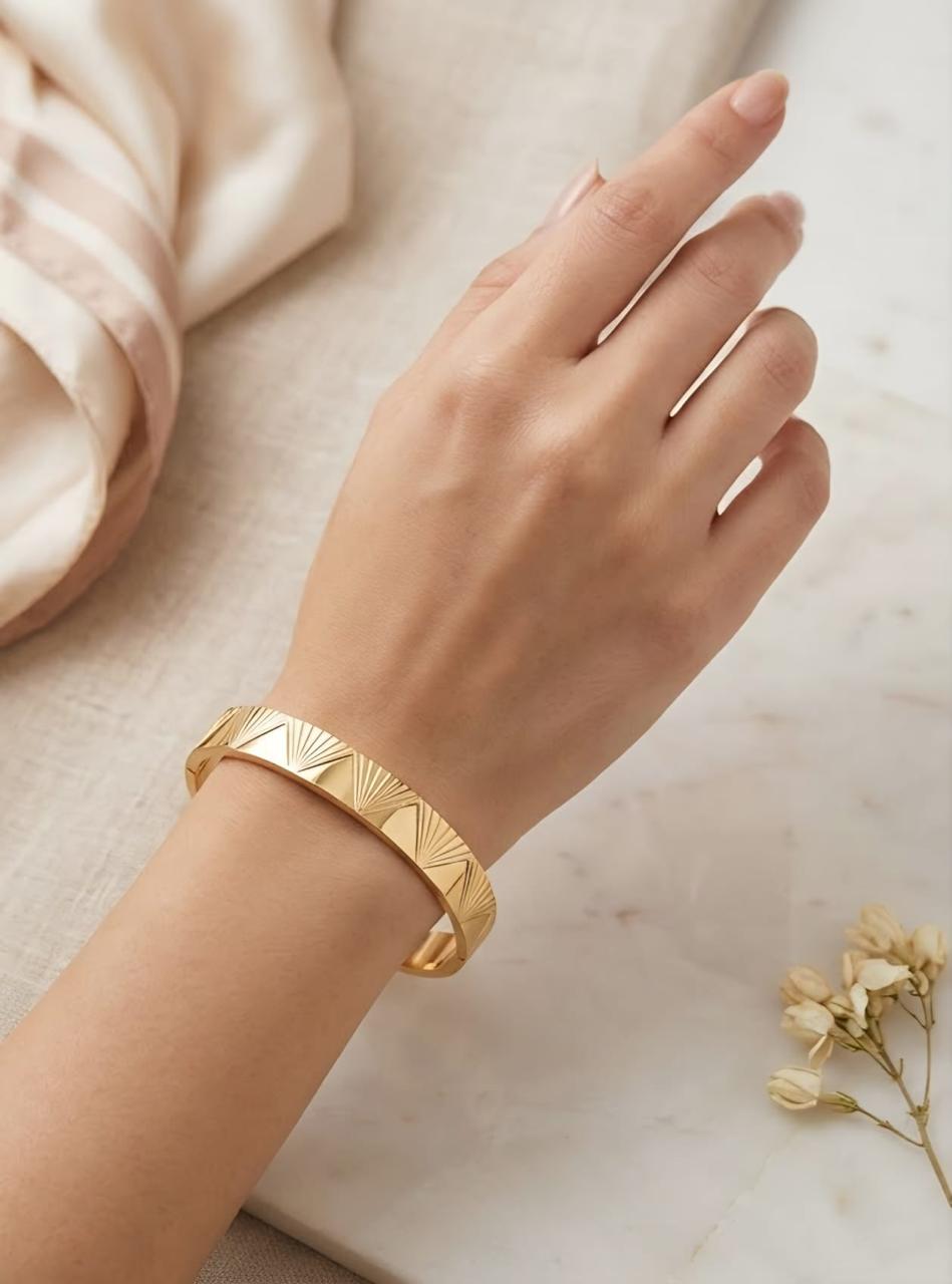 Gold-colour sunburst design cuff bracelet