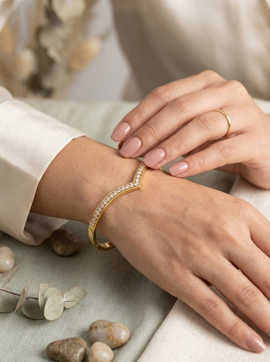Gold-colour cuff bracelet with V-shaped clear stone detail