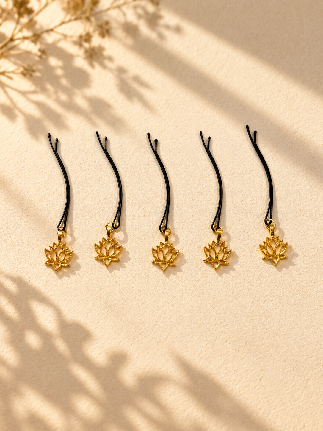 Gold lotus charm hair pins displayed individually