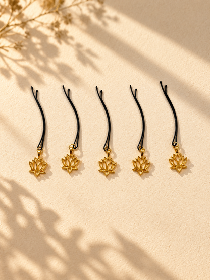 Gold lotus charm hair pins displayed individually