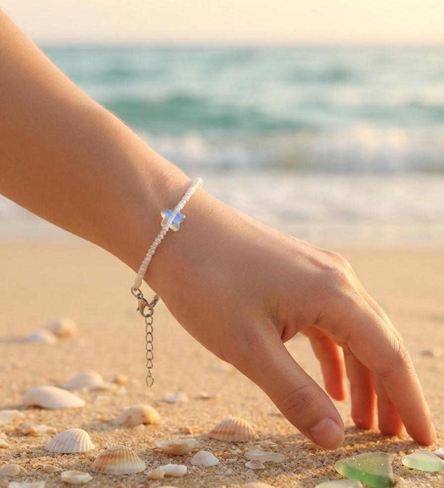 White bead bracelet with blue star charm