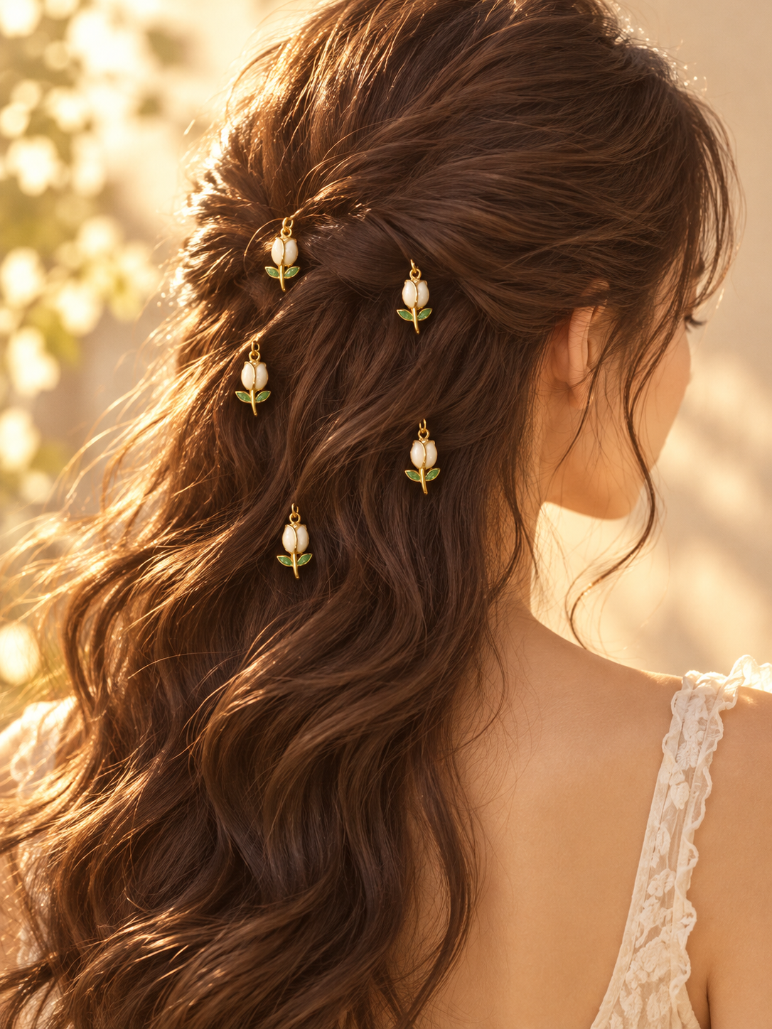 White tulip charm hair pins styled in hair