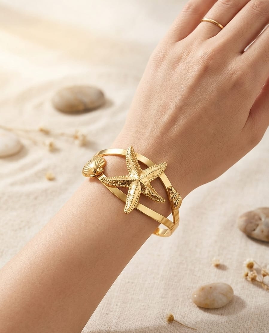 Women's gold-colour cuff bracelet with starfish and shell details